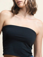 Model wears 98degreenorth Women Cotton Black Crop Tube Top, shown from shoulders to waist against a neutral background.