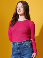 Woman in 98degreenorth fuchsia ribbed sweater, styled for bold winter fashion against a yellow backdrop.