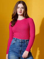 Woman in a 98degreenorth Fuchsia Ribbed Sweater models bold winter style against a yellow backdrop.