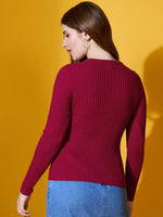 Woman in a 98degreenorth maroon round neck ribbed sweater stands against a yellow background, facing away.