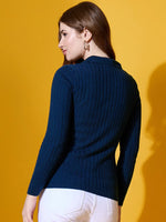 Woman in 98degreenorth Midnight Blue Ribbed Collar Sweater, facing away against yellow background.
