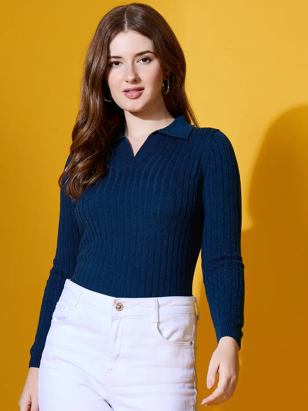 Woman wears 98degreenorth Midnight Blue Ribbed Collar Neck Sweater, standing against a yellow background.