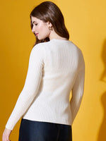 Woman with long brown hair in 98degreenorth Off White Ribbed Sweater, posing with her back to the camera.