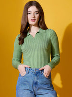 Woman wears 98degreenorth Pear Collar Neck Sweater and blue jeans against a bright yellow background.