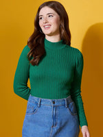 Woman in a 98degreenorth emerald green ribbed high neck sweater smiles against a yellow background.