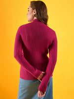Woman in a 98degreenorth fuchsia ribbed high neck sweater stands against a bright yellow background, facing away.