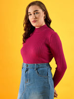 Woman wears 98degreenorth Fuchsia Ribbed High Neck Sweater and denim skirt against a bright yellow background.