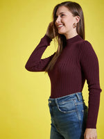 Woman smiling in a 98degreenorth Wine Ribbed High Neck Sweater, standing against a bright yellow background.