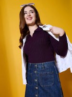 Woman in a 98degreenorth Rosewood Collar Neck Ribbed Sweater holds a white jacket, standing against a yellow background.