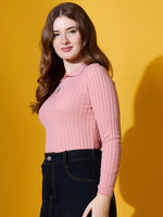 Woman in 98degreenorth’s salmon ribbed collar neck sweater exudes winter style against a yellow backdrop.