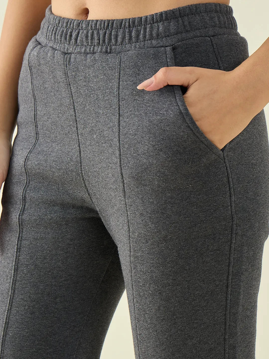 A person wearing 98degreenorth Women’s Anthra Flared Bootcut Sweatpants with Side Slit.