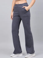 Woman in 98degreenorth Anthra Fleece Flared Sweatpants channels street style with a hand in her pocket.