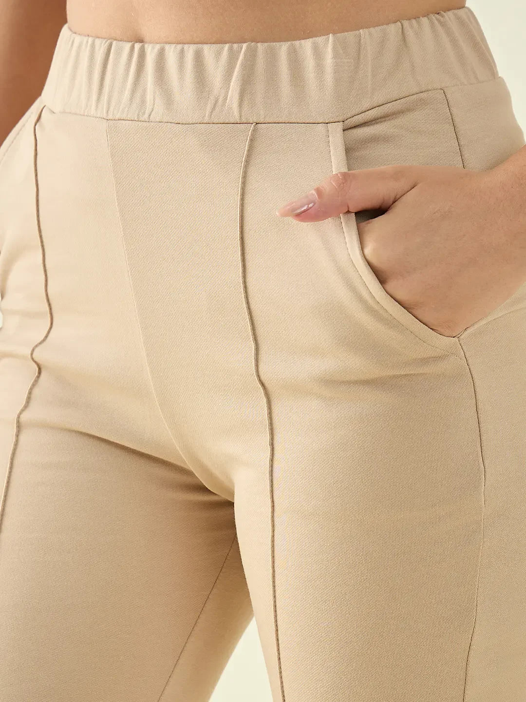 Close-up of 98degreenorth Women's Beige Flared Bootcut Cotton Stretchable Trousers, perfect for casual or office wear.