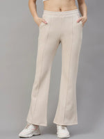 98degreenorth Women’s Beige Fleece Flared Lounge Pants offer warm, stylish winter loungewear against a gray backdrop.