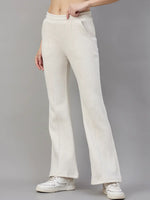 Model wears 98degreenorth Women’s Beige Fleece Flared Sweatpants—minimal streetwear style, with white sneakers.