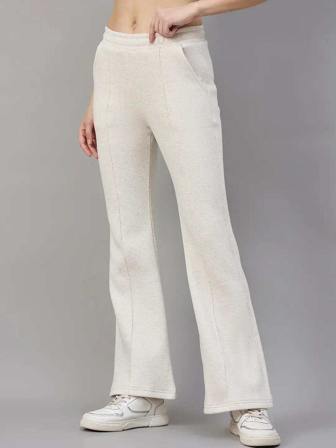 Model wears 98degreenorth Women’s Beige Fleece Flared Sweatpants—minimal streetwear style, with white sneakers.