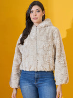 Woman wears 98degreenorth Beige Luxe Faux Fur Hooded Jacket and blue jeans, standing against a yellow background.
