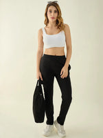 Woman wears 98degreenorth Black Regular Fit Cotton Stretchable Trousers—Timeless Workwear Pants—against light background.