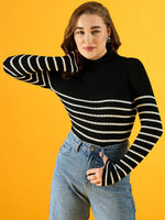 Woman in 98degreenorth’s black ribbed striped turtleneck sweater smiles against a vivid yellow background.
