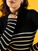 Woman wears 98degreenorth Women’s Black Ribbed Striped Turtleneck Sweater, winterwear, against a yellow background.