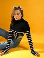 Woman in 98degreenorth Women’s Black Ribbed Striped Turtleneck Sweater and jeans, India, against a yellow background.