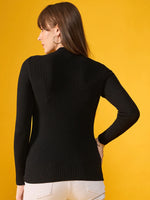 Woman in a 98degreenorth black ribbed slim fit turtleneck sweater faces away against a yellow background.