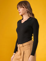 Woman in 98degreenorth Women’s Black Stretchable Ribbed Collar Sweater poses against a solid yellow background.