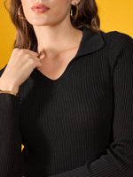 Woman in 98degreenorth Women’s Black Stretchable Ribbed Collar Sweater, gold jewelry, on a yellow background.
