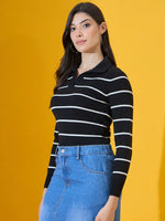 Woman wears a 98degreenorth Black Striped Collared Knit Sweater, standing against a yellow background.