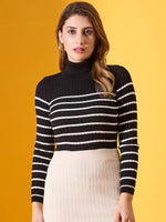 Woman in 98degreenorth Black Striped Ribbed High Neck Sweater, standing against a yellow background.