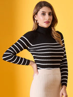 Woman in 98degreenorth Women's Black Striped Ribbed High Neck Sweater, standing against a yellow background.