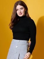 Woman with long brown hair wears 98degreenorth's black ribbed turtle-neck sweater, styled against a yellow background.