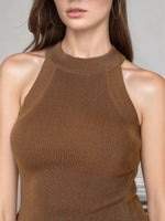 A woman in a 98degreenorth Women’s Brown Ribbed Halter Neck Sleeveless Knit Top and hoop earrings.