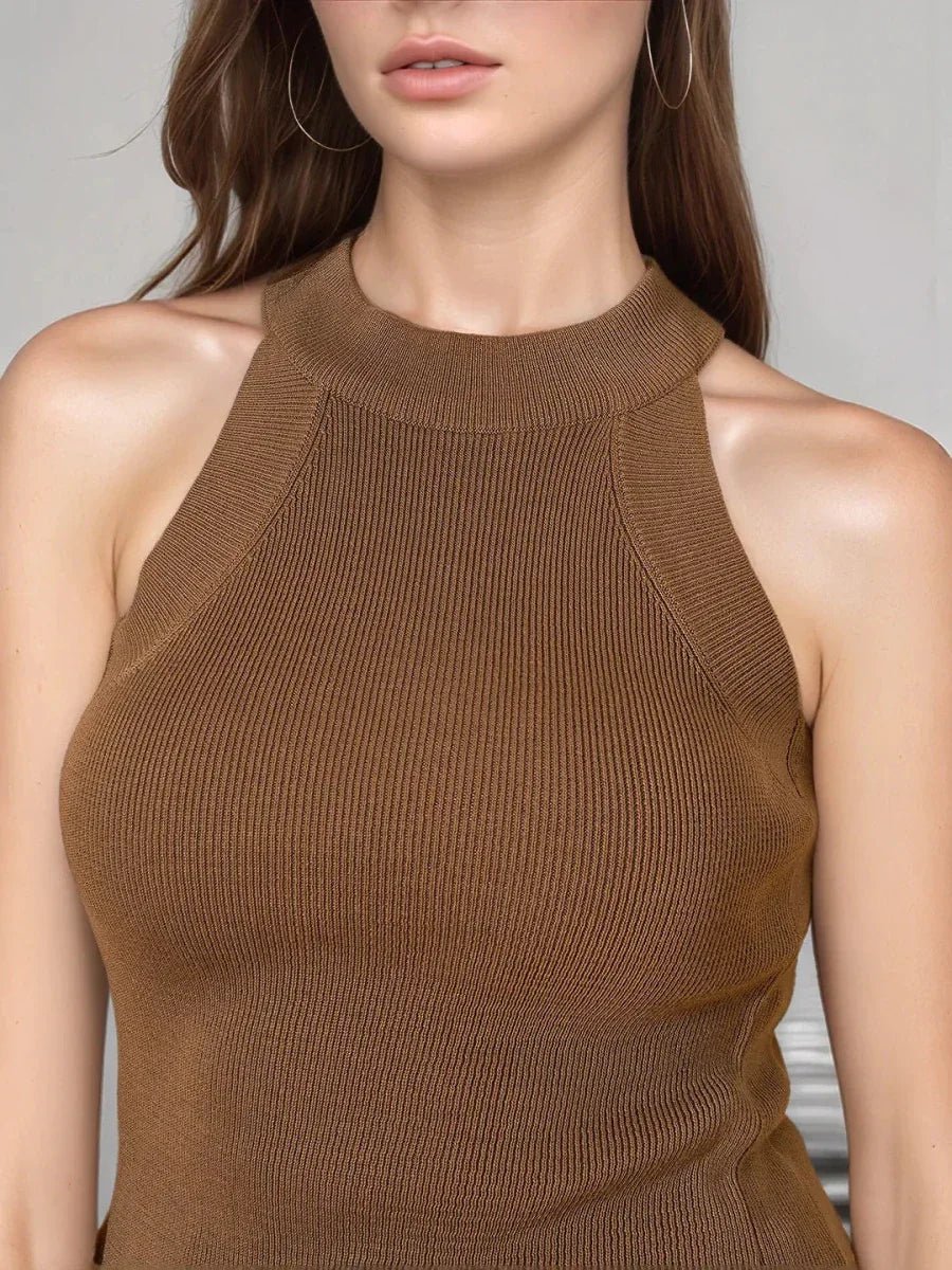 A woman in a 98degreenorth Women’s Brown Ribbed Halter Neck Sleeveless Knit Top and hoop earrings.