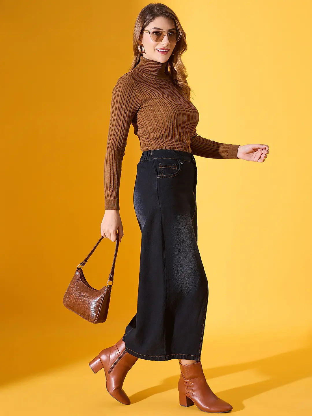 A woman models the 98degreenorth brown ribbed turtleneck sweater—chic high neck, slim fit, perfect winter style.