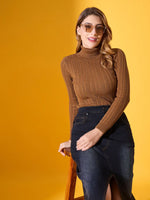 Woman in 98degreenorth’s brown ribbed turtleneck sweater posing against a yellow background.
