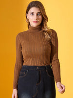 Woman in 98degreenorth brown ribbed turtleneck slim fit sweater and dark jeans poses against a yellow background.
