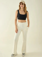 Woman in a black crop top, sunglasses, and 98degreenorth Women’s Butter Flared Fit Bootcut Cotton Stretchable Trousers.