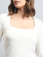 Indian woman wears the 98degreenorth Women’s Butter Square Neck Long Sleeve Top, shown shoulders to above chest.