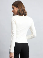 Woman with chin-length brown hair in a 98degreenorth Butter Square Neck Long Sleeve Top and black pants, seen from the back.