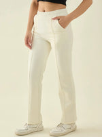 Wearing 98degreenorth Women’s Butter Straight Fit Cotton Stretchable Trousers, black crop top, and white sneakers.