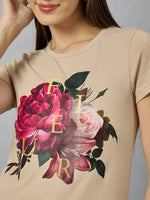 A woman wears a 98degreenorth women’s casual typography t-shirt with a round-neck for easy everyday style.