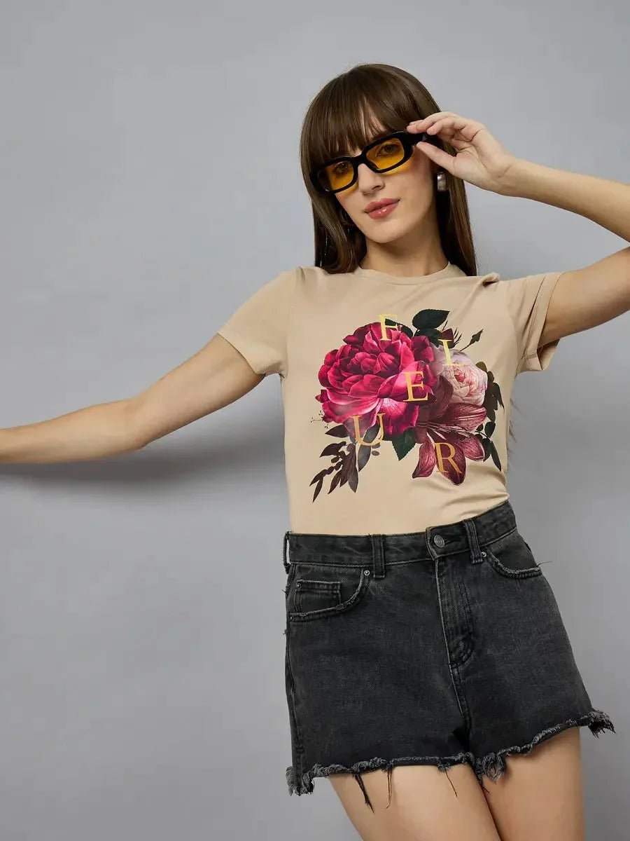 Woman in sunglasses wears the 98degreenorth women’s casual typography t-shirt, posing against a plain gray background.