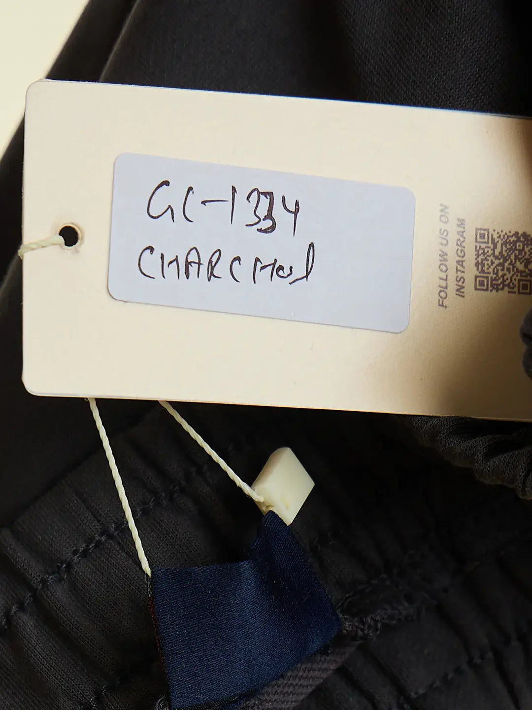 Close-up of tag reading GC-134 CHARCOAL on 98degreenorth Women’s Charcoal Flared Fit Bootcut Cotton Trousers.