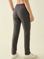 Model wears 98degreenorth Women’s Charcoal Regular Fit Cotton Stretchable Trousers, shown from the back.