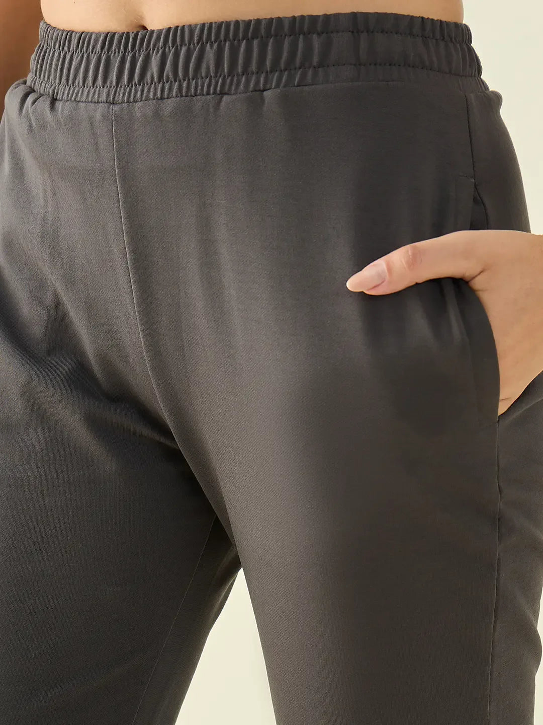 Close-up of 98degreenorth Women’s Charcoal Cotton Stretchable Trousers with elastic waist and right pocket detail.