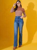 Woman wears 98degreenorth Women’s Dark Camel Ribbed Turtleneck Sweater, posing against a yellow background.
