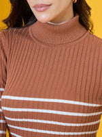 Woman in a 98degreenorth dark camel ribbed turtleneck sweater, premium winterwear, against a yellow background.