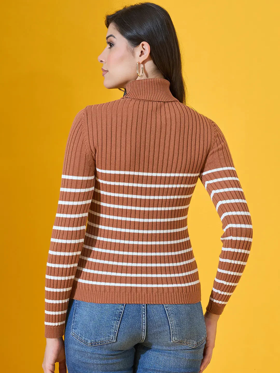 Woman with long dark hair in a 98degreenorth Dark Camel Ribbed Turtleneck Sweater, facing away.