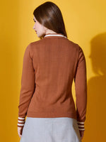 Woman wearing 98degreenorth’s Dark Camel Striped-Collar Knit Sweater, pictured from behind with a grey skirt.